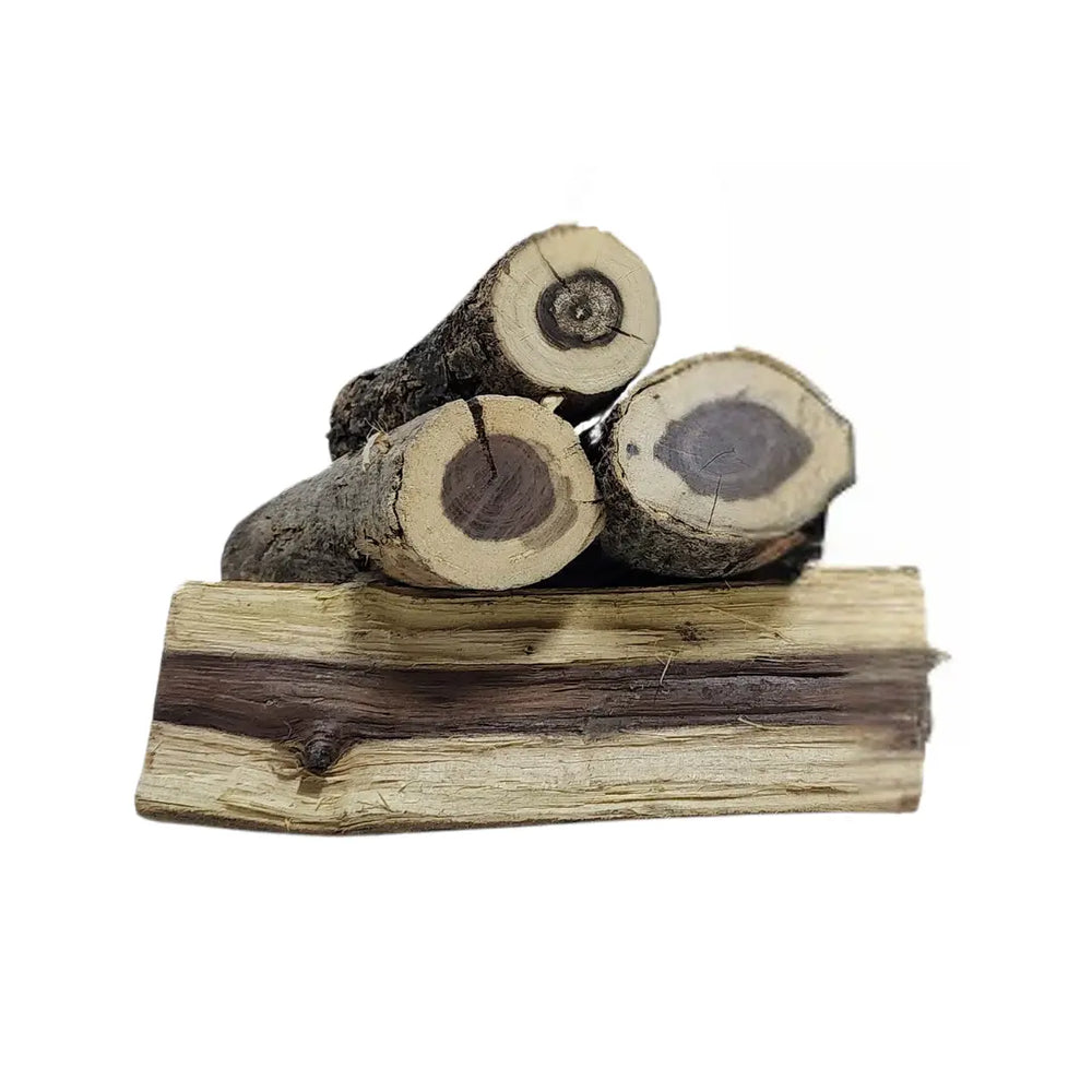 Cubanar Saman Hardwood logs showcasing their natural texture and durability, perfect for fireplaces and outdoor fires