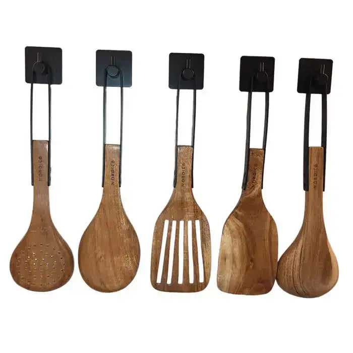 Set of five Nordico wooden kitchen utensils including soup ladle, spoon, slotted turner, and spatula, hanging on black hooks.
