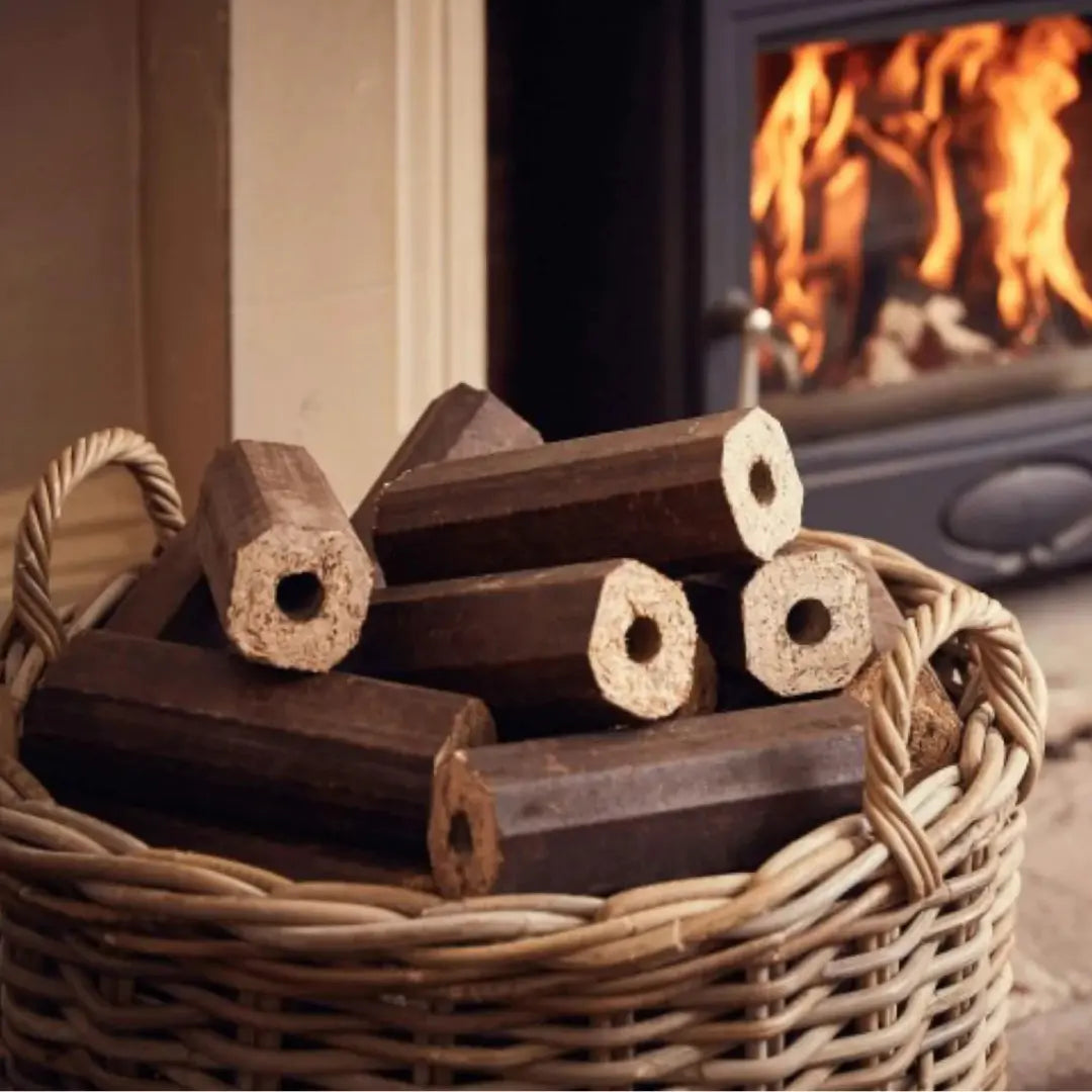 Barari Firewood hexagonal sawdust logs neatly stacked in a wicker basket, perfect for fireplaces, fire pits, and outdoor fires.