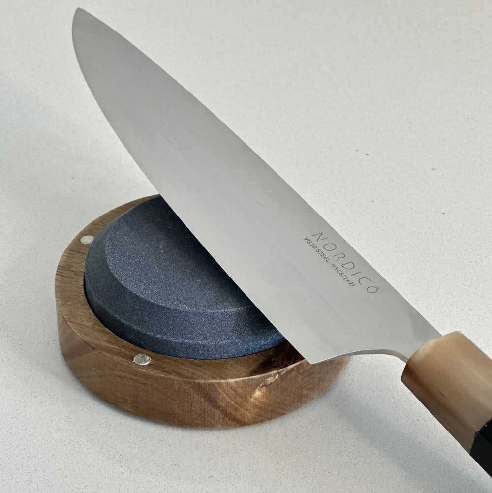 Nordico VG10 chef knife being sharpened on the El Afilador whetstone.