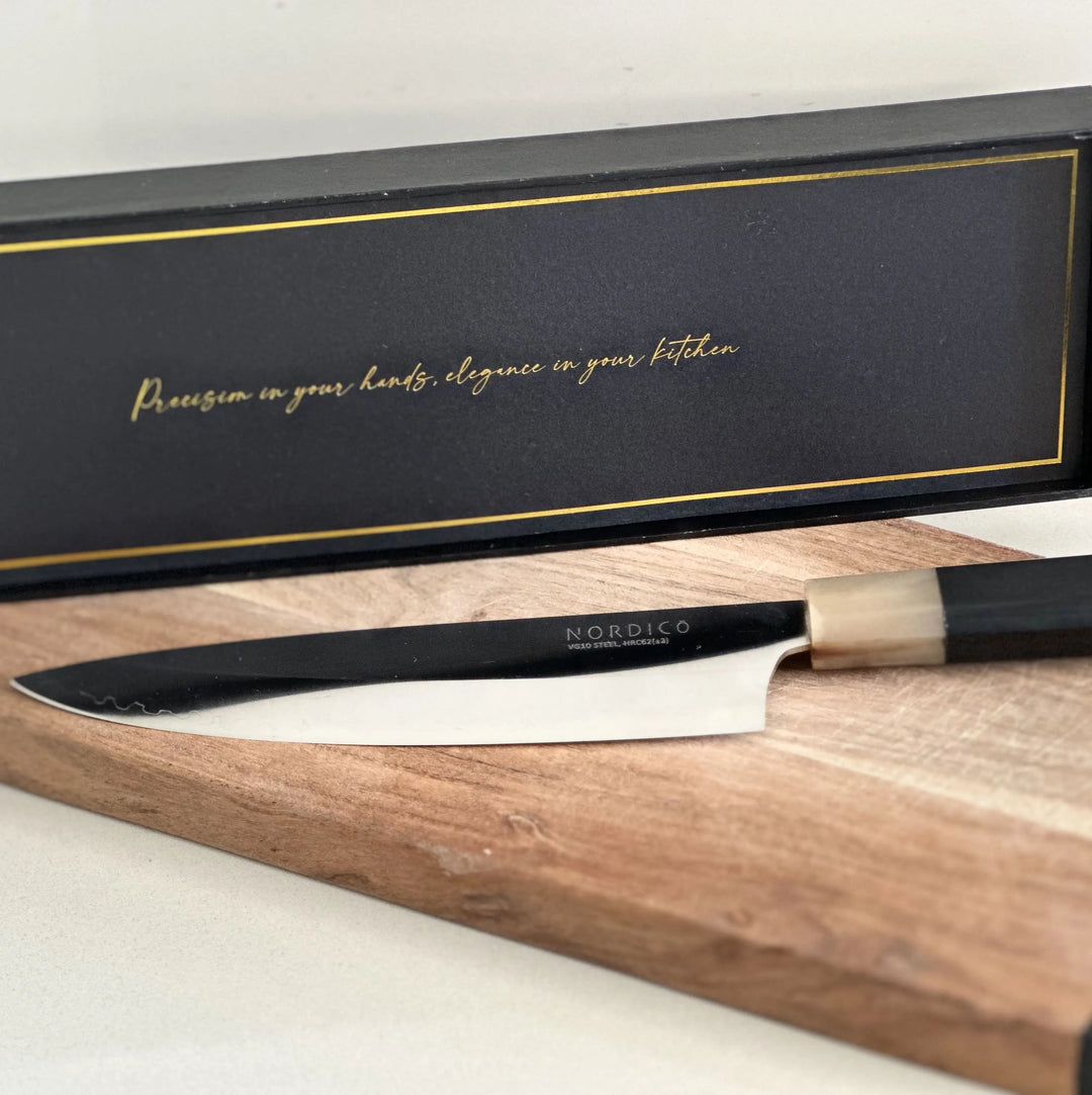 Nordico VG10 Chef Knife in its premium black gift box with golden accents, perfect for gifting.