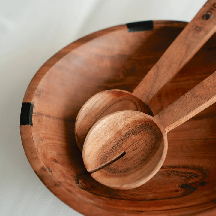 NORDICO wooden bowl paired with acacia wooden utensils, highlighting its smooth finish and handcrafted details