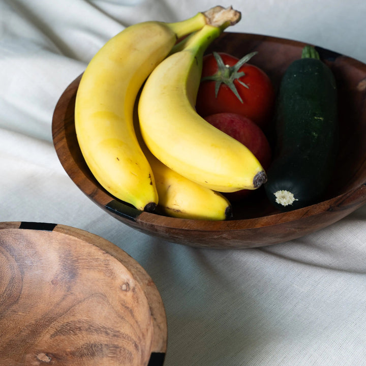 NORDICO wooden bowl filled with bananas, zucchini, and tomatoes, ideal for serving fruits or salads.