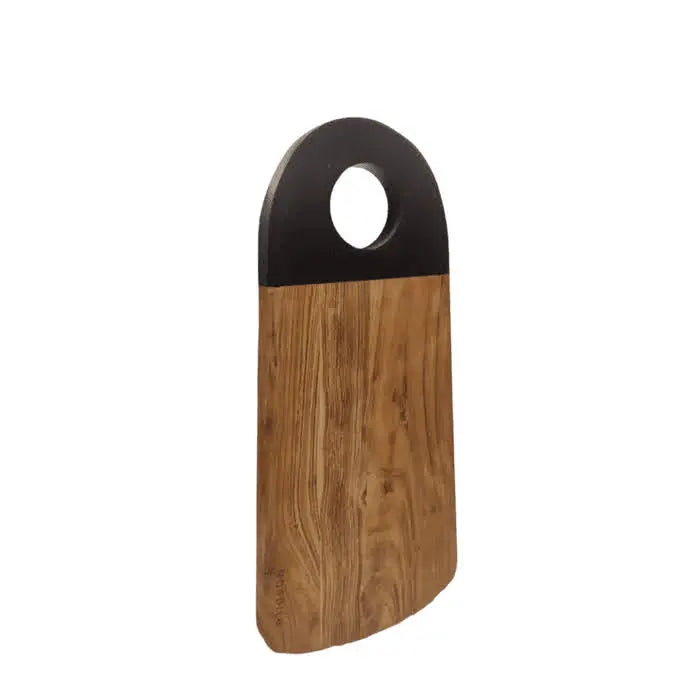 Standing Nordico acacia cutting board with black handle and round hole, showcasing its Nordic design.
