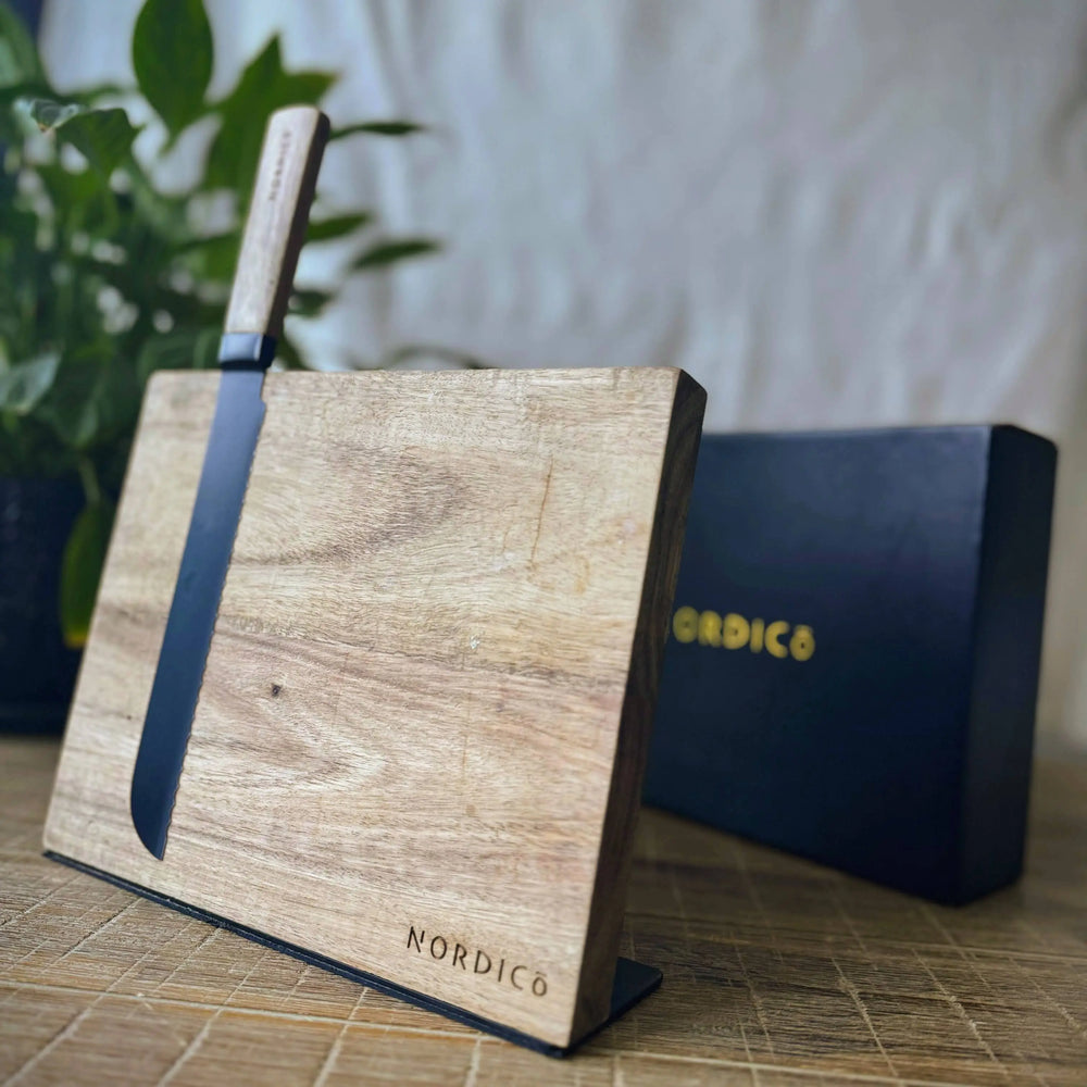 Nordico magnetic knife block made from acacia wood with a knife attached, luxury kitchenware.