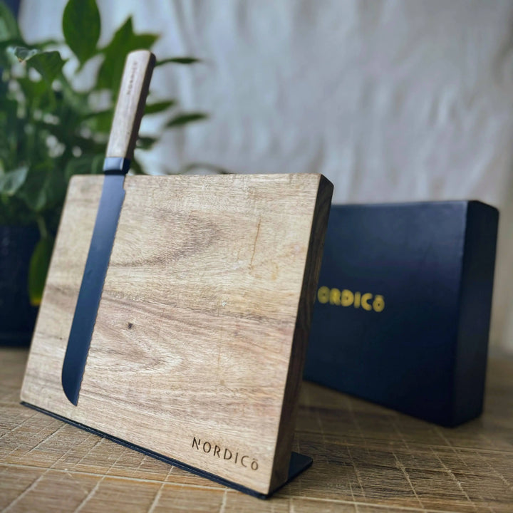 Nordico magnetic knife block made from acacia wood with a knife attached, luxury kitchenware.