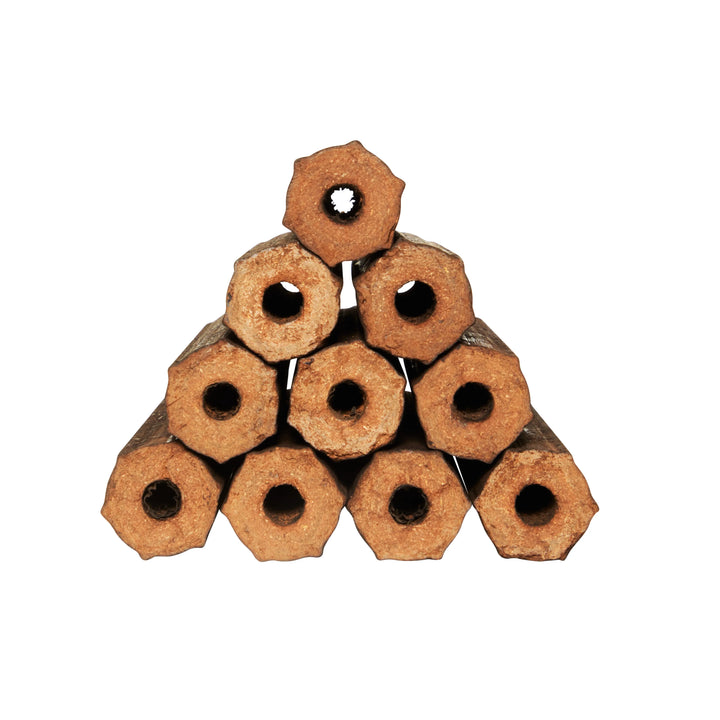 Stacked Royal BBQ Eco Large Firewood briquettes in a 4-piece pack, perfect for indoor fireplaces and outdoor fire pits.