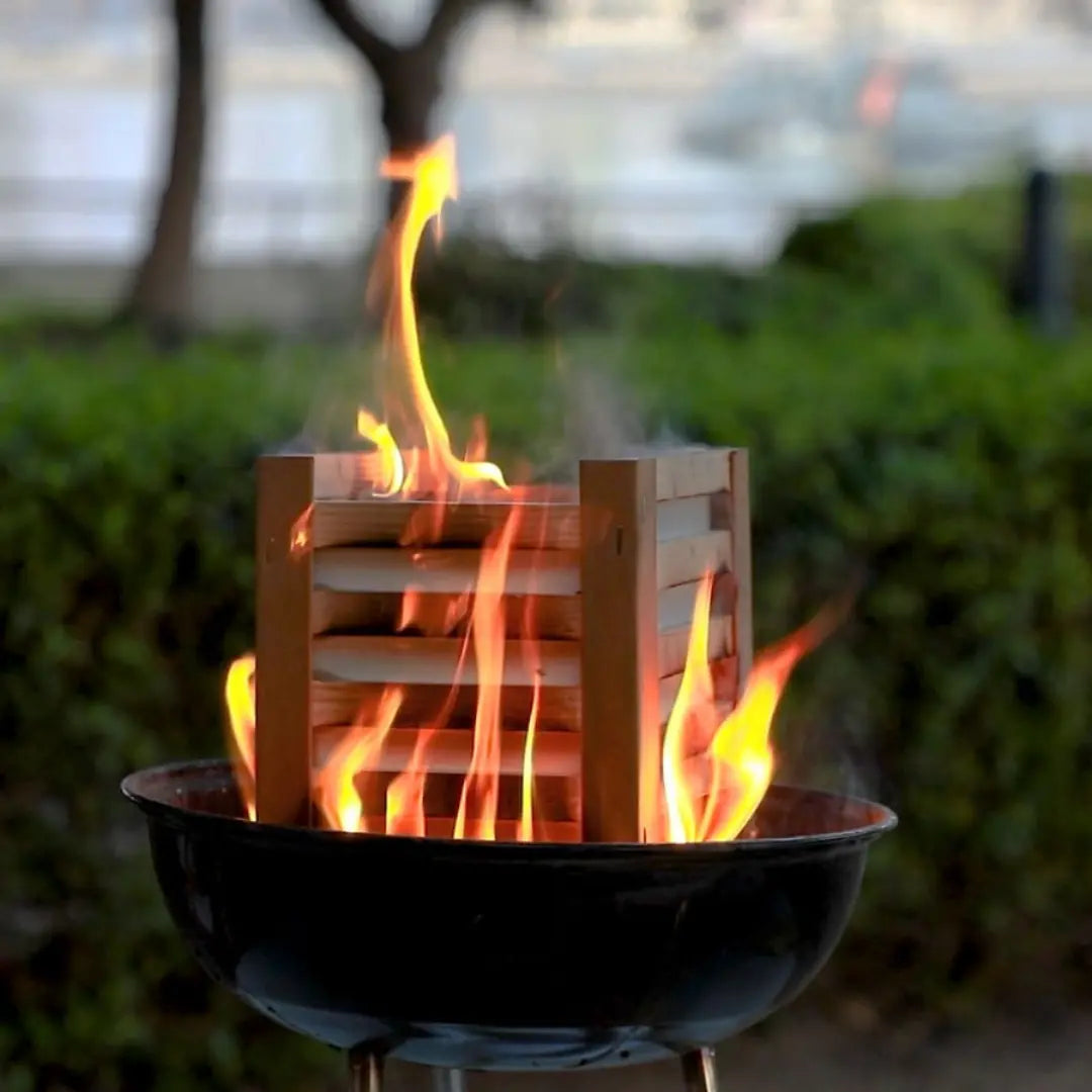 Royal BBQ briquettes burning brightly in a grill, offering consistent heat for outdoor cooking.